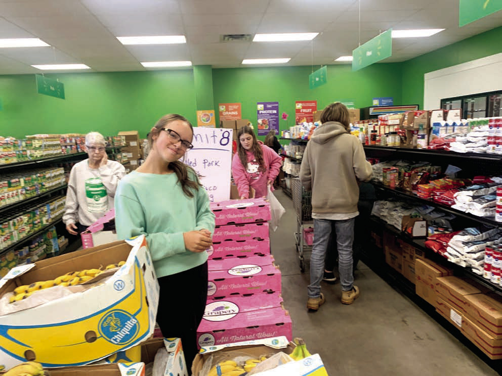 Dale FFA students assist in shopping at the Community Market of Pottawatomie County. Dale FFA placed second in the First United Bank Harvesting Impact contest in December 2024. North Rock Creek FFA placed first, and Shawnee High School FFA came in third. Photo provided by Jon Golliver.