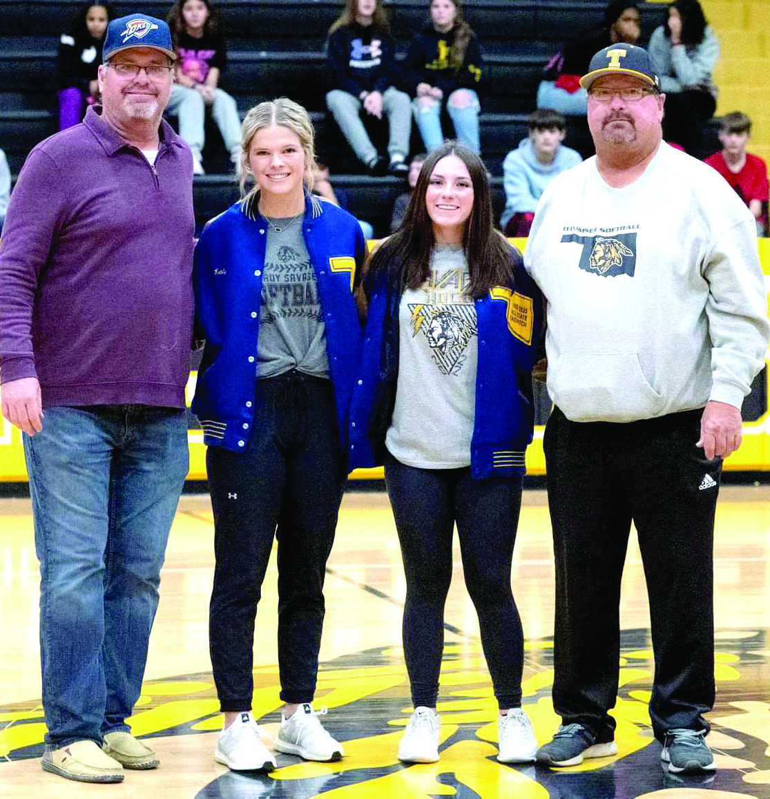 Tecumseh’s Katelyn Fleming and Bristin Hayes received their All-State letter jackets for fastpitch softball during the home basketball game on Feb. 7. They are shown here with softball coaches Chad Trahan, far left, and Perry Wilson. Photo provided by Kenetta Lisenbee.