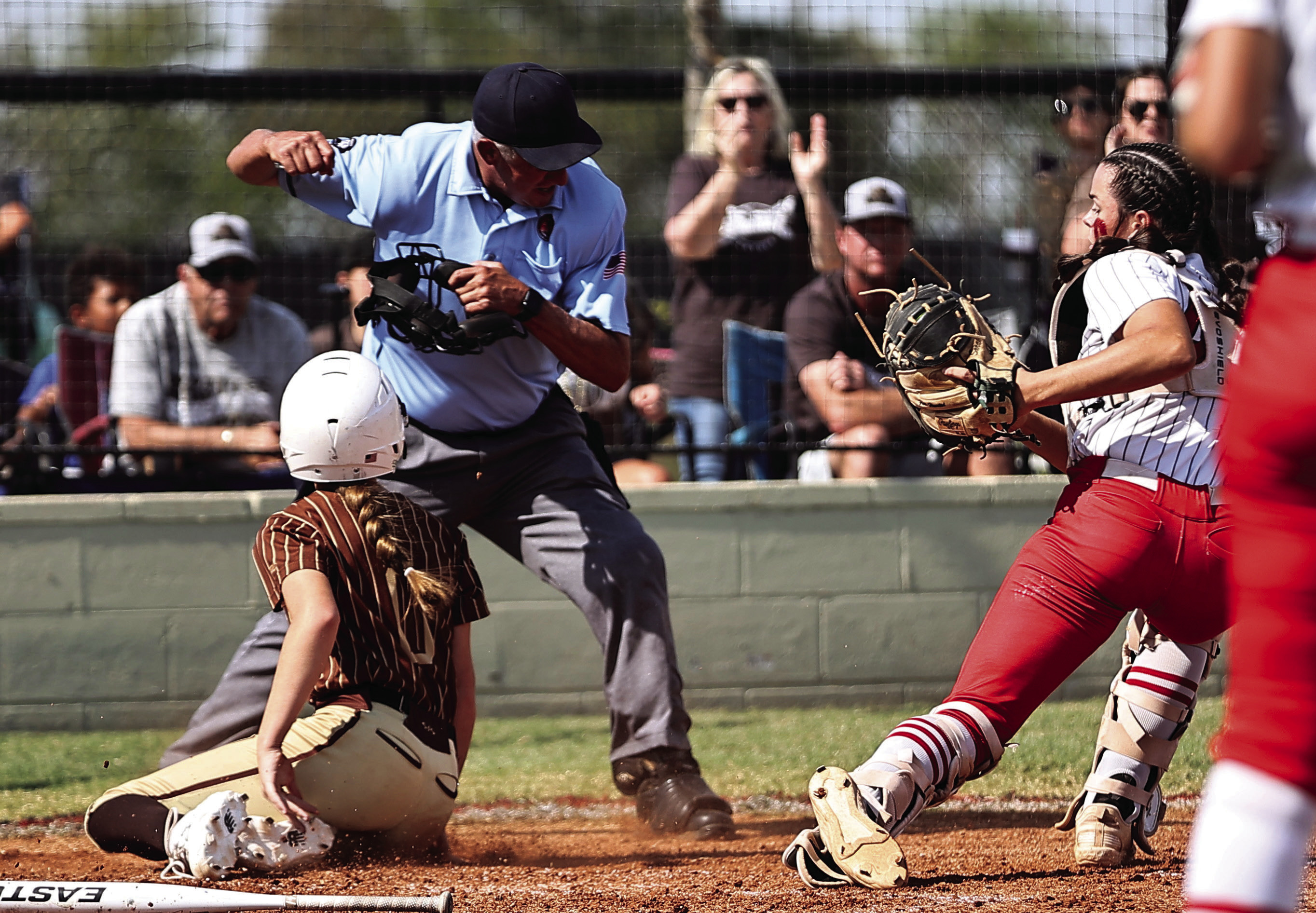 North Rock Creek’s Sarah Campbell tags the Elk City runner for the out in action during Super Regionals on Oct. 10. The Lady Cougars lost two games with Elk City, 3-4 & 1-7, to end their season with a record of 31-8. Photo courtesy of Gowin Photography