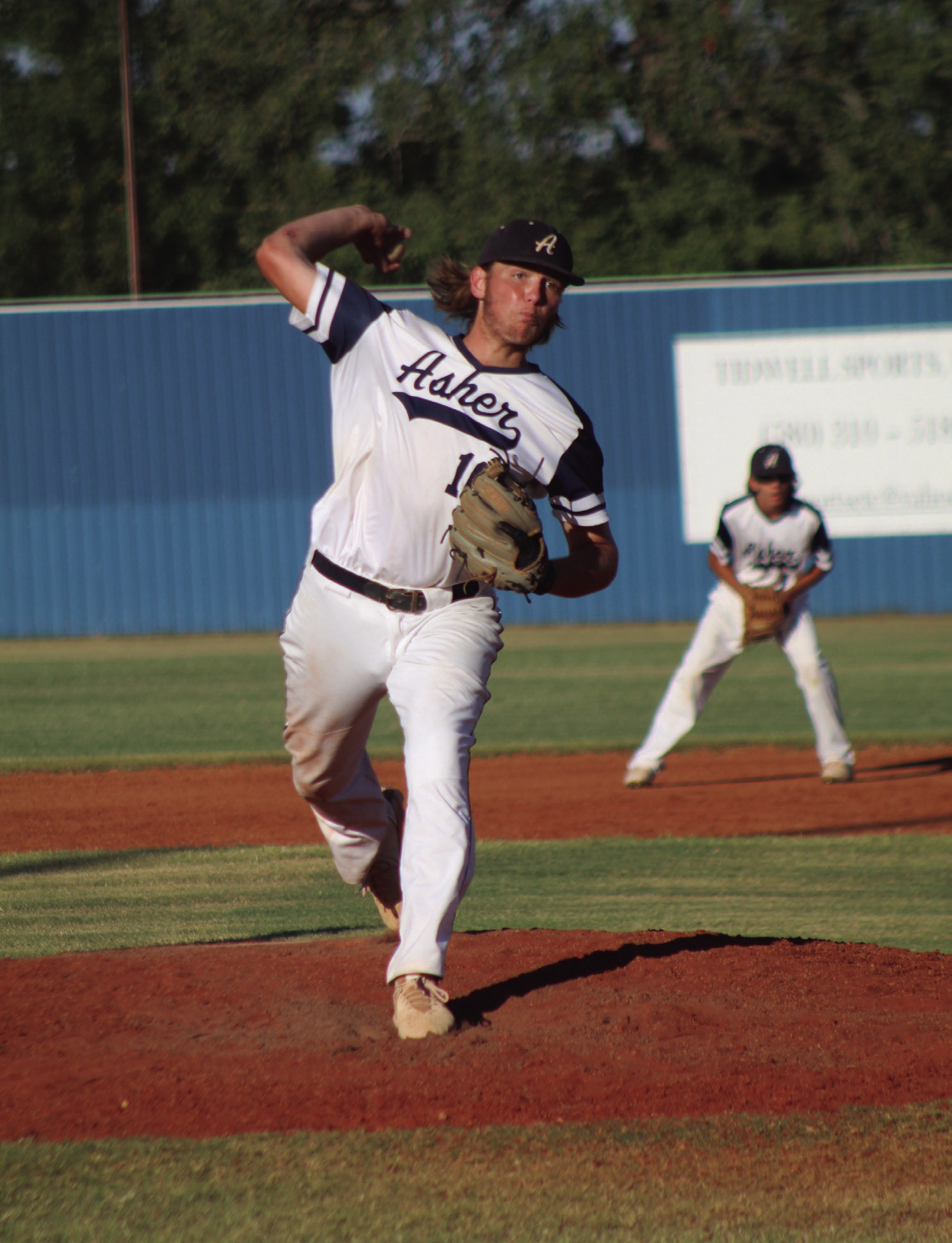 Asher junior Bryce Lamb winds up for the pitch in the home game with Dale. Countywide &amp; Sun/Natasha Dunagan