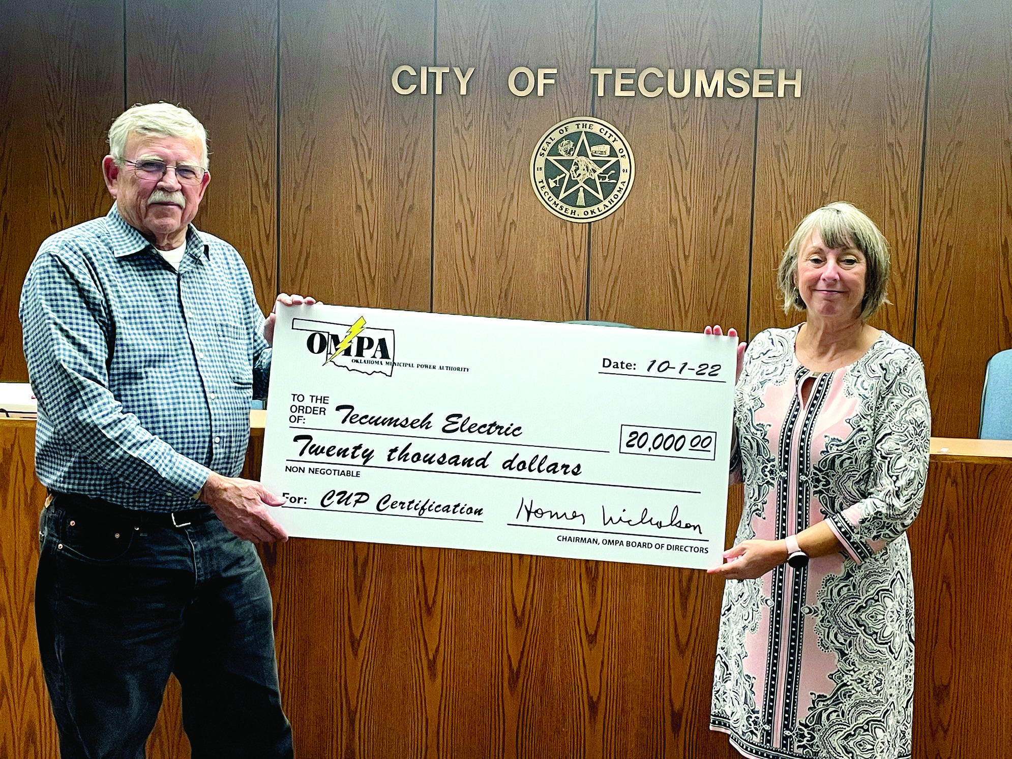 Tecumseh Mayor Eddy Parker accepts a $20,000 check from Oklahoma Municipal Power Authority Representative Palma Lowewith. Countywide &amp; Sun/Ryan Ackerman