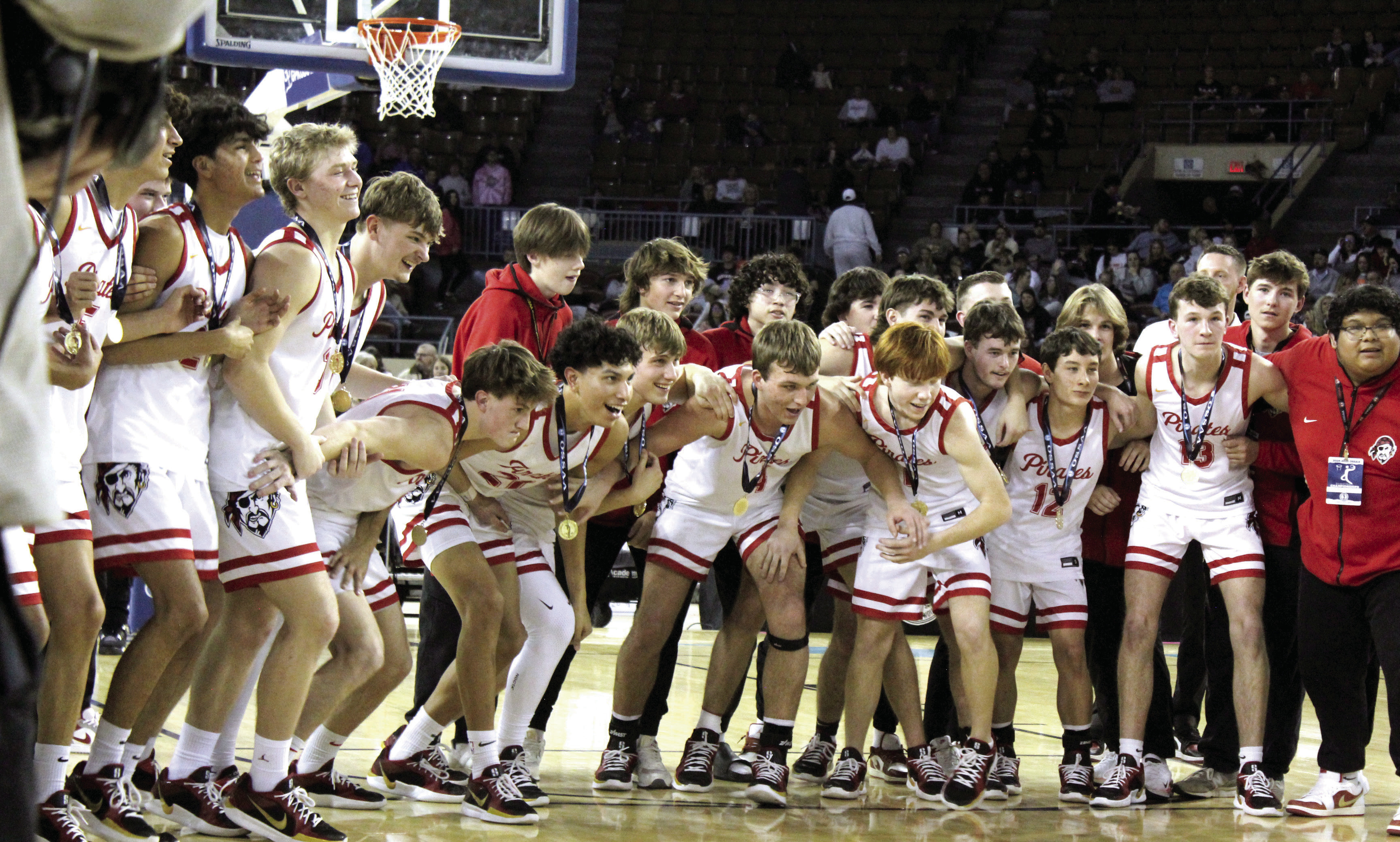The Dale Pirates Basketball Team prepares to run up and claim the golden basketball trophy after winning the OSSAA Class 2A Basketball State Championship on March 8 at the State Fair Arena. The Pirates won against Cashion on March 6, 74-55; Fairland on March 7, 76-51; and, Pocola on March 8, 60-20, to take state for the fourth year straight. They end the season with a record of 30-2. Read the full story on page B1. Natasha Dunagan, Countywide & Sun