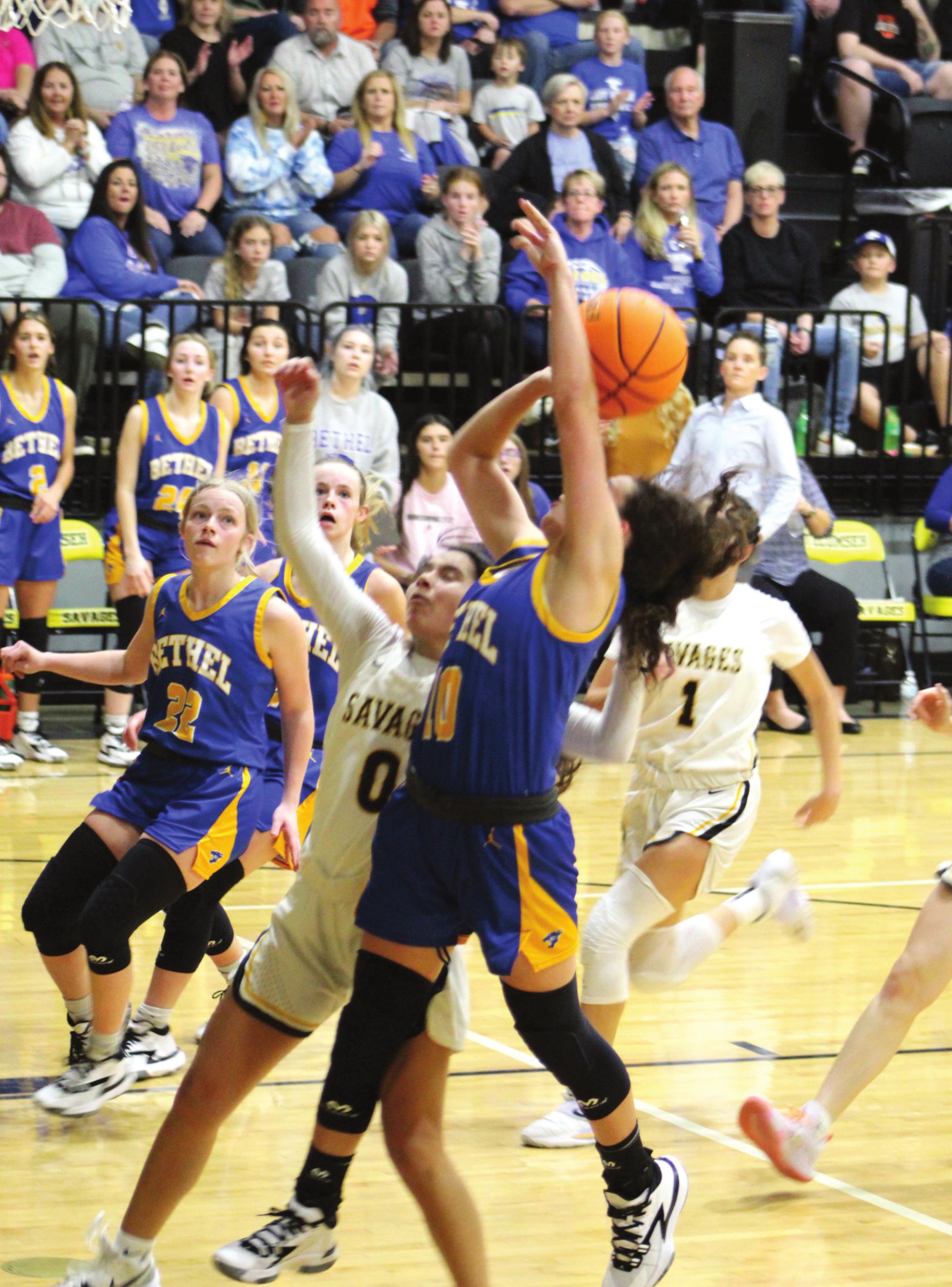 Bethel’s Parker Stevenson (#10) goes in for the shot and draws a foul against Tecumseh’s Jadyn Wilson (#0) during the Tecumseh home game on Dec. 3. Bethel won 71-57. Countywide &amp; Sun/Natasha Dunagan