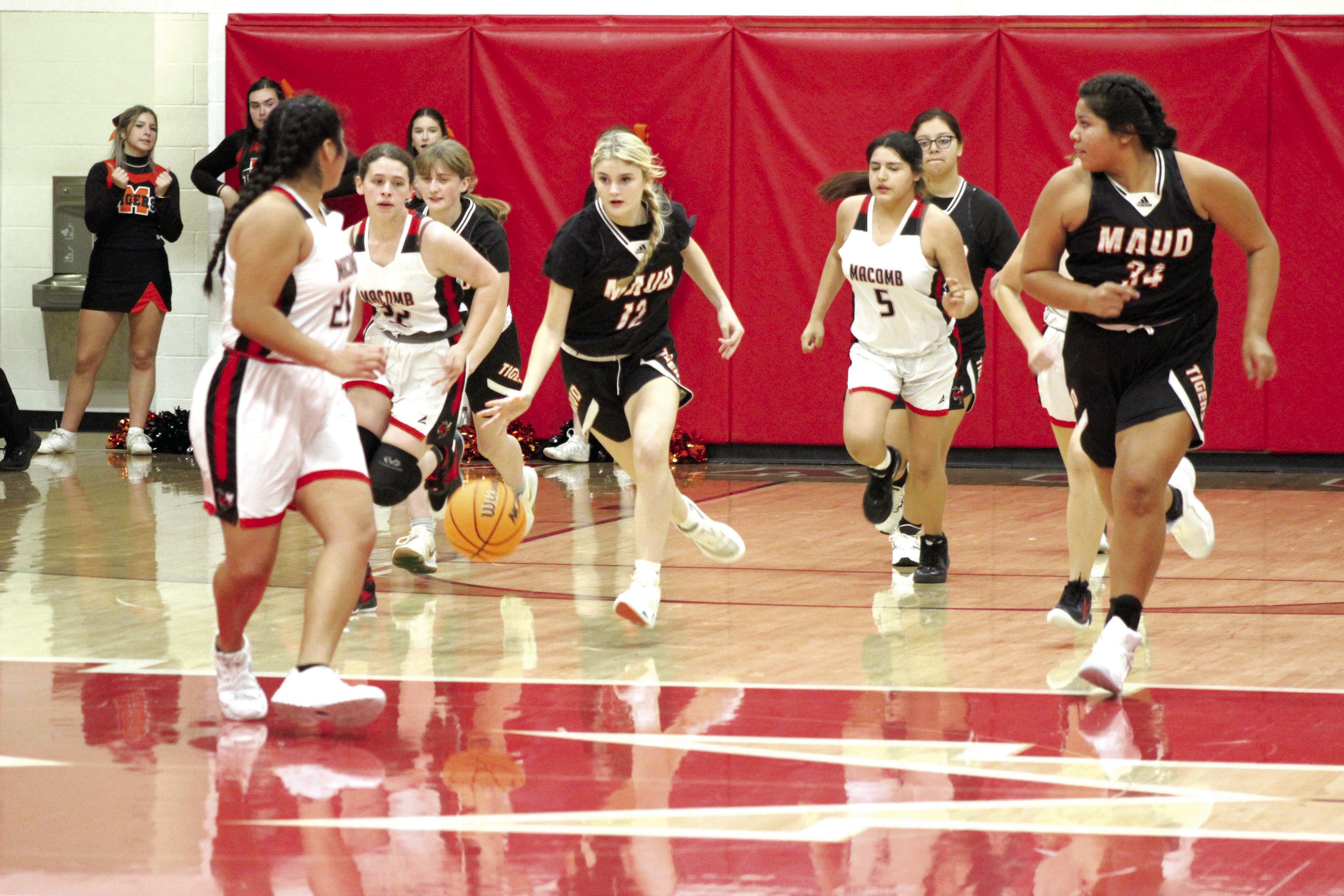 Maud freshman Aubri Kueneman moves the ball down the court during the fourth quarter of the game at Macomb, Nov. 28. The Maud Lady Tigers won, 51-33. Countywide &amp; Sun/Natasha Dunagan