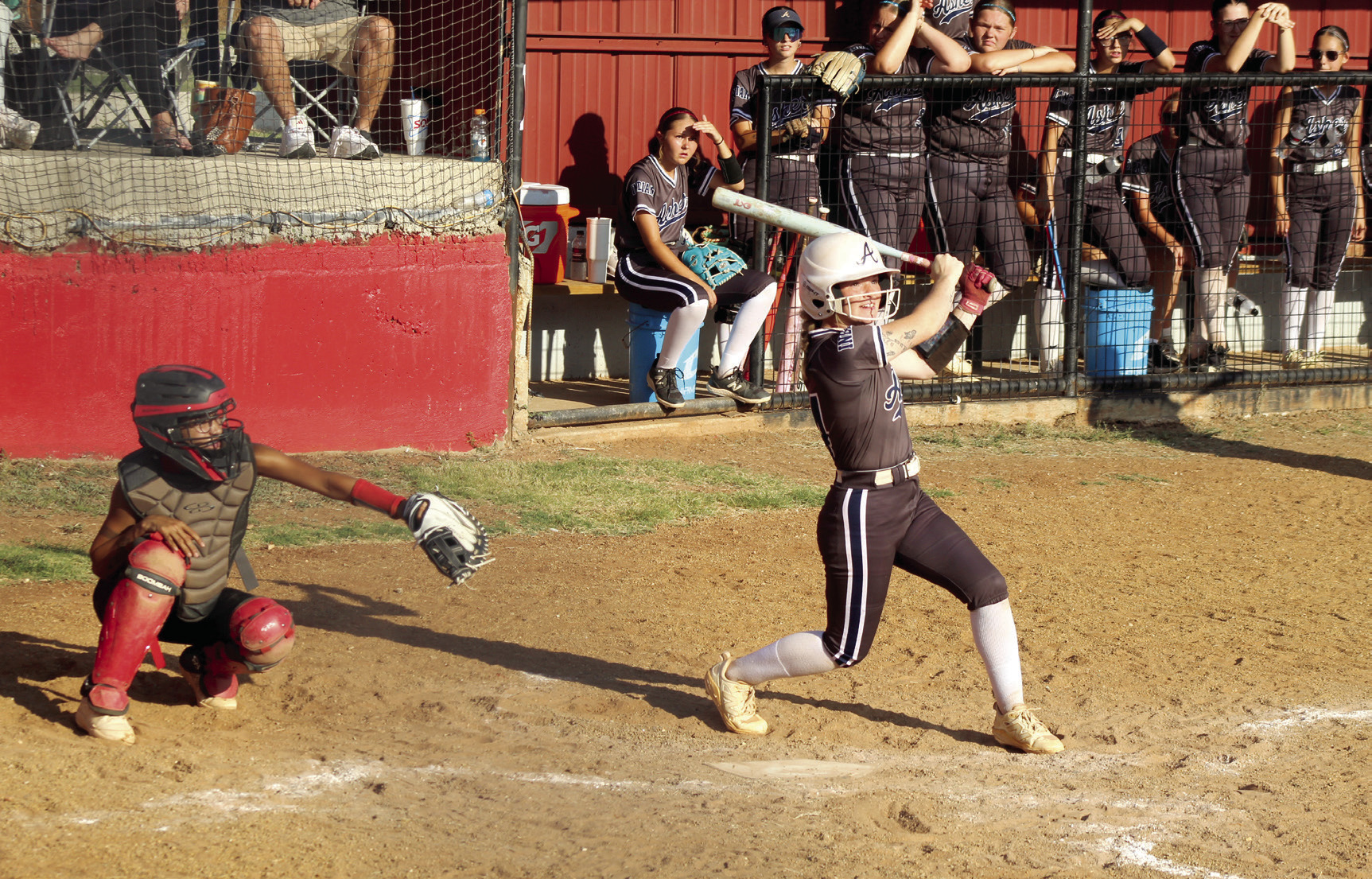 Asher senior Makaylee Harrell decks a double during the Sept. 4 game at Earlsboro. Also shown is Earlsboro catcher, senior Molli Bustos. The Asher Lady Indians won 5-0. Photos by Natasha Dunagan, Countywide & Sun