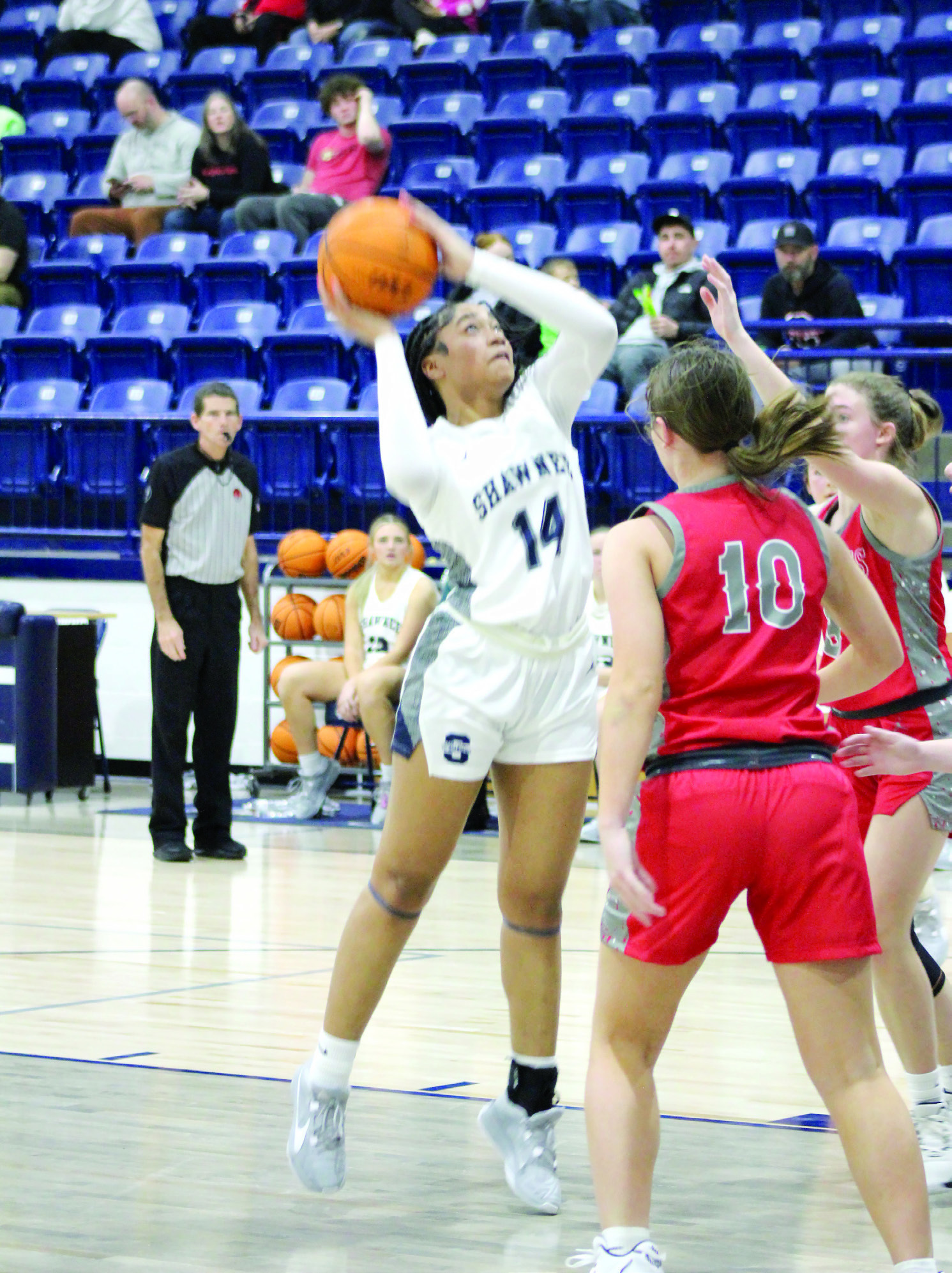 Shawnee freshman Chrishelle Milum tries for a basket but is fouled in the third quarter of the Dec. 15 game against Crossings Christian. Playing back on the newly-repaired Performing Arts and Athletic Center, the Lady Wolves won, 56-34. The Wolves came up short, 47-67. Countywide & Sun/Natasha Dunagan