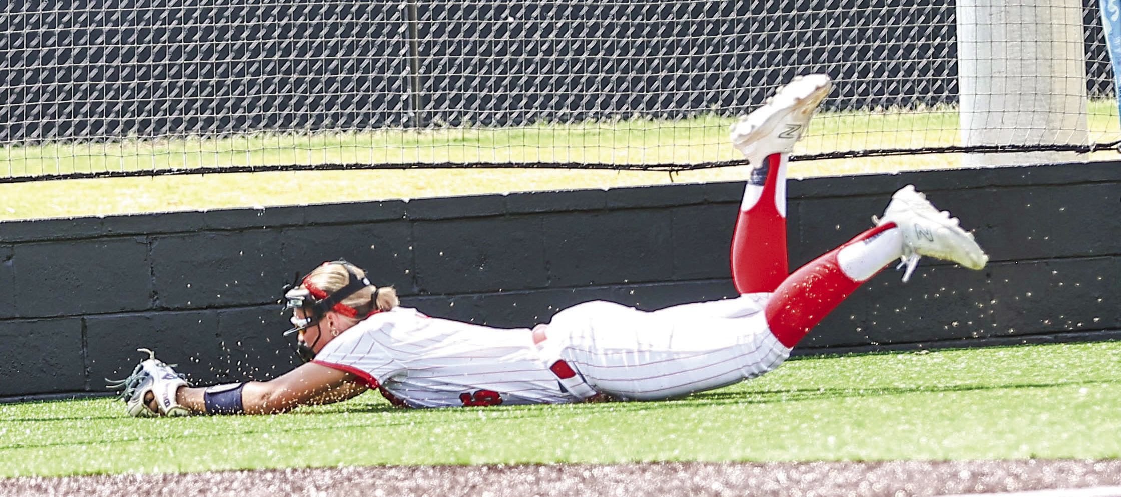 Senior Aspyn Harder makes a diving catch for the out on Aug. 11 when NRC softball took on Cleveland in a district game, winning 16-6, on Aug. 11. Photos courtesy of Gowin Photography