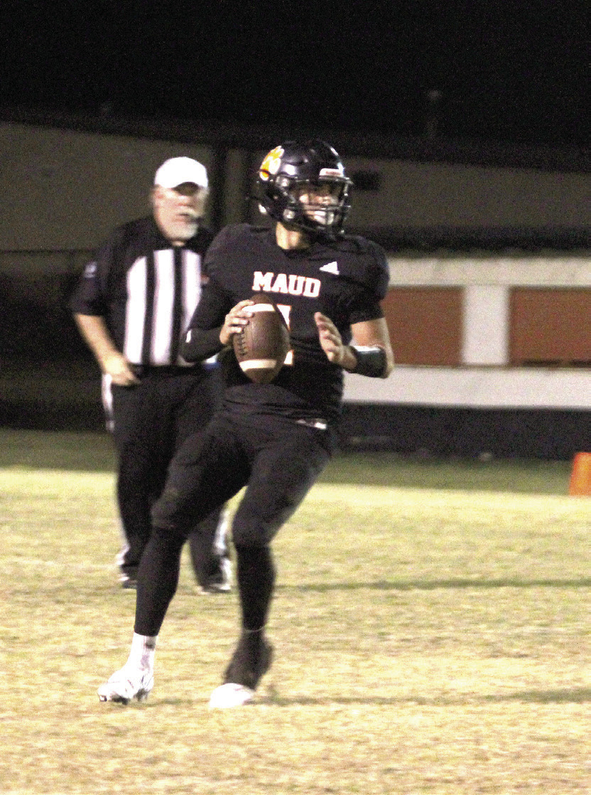 Maud sophomore Trenton Marshall looks to pass before running a quarterback keeper.