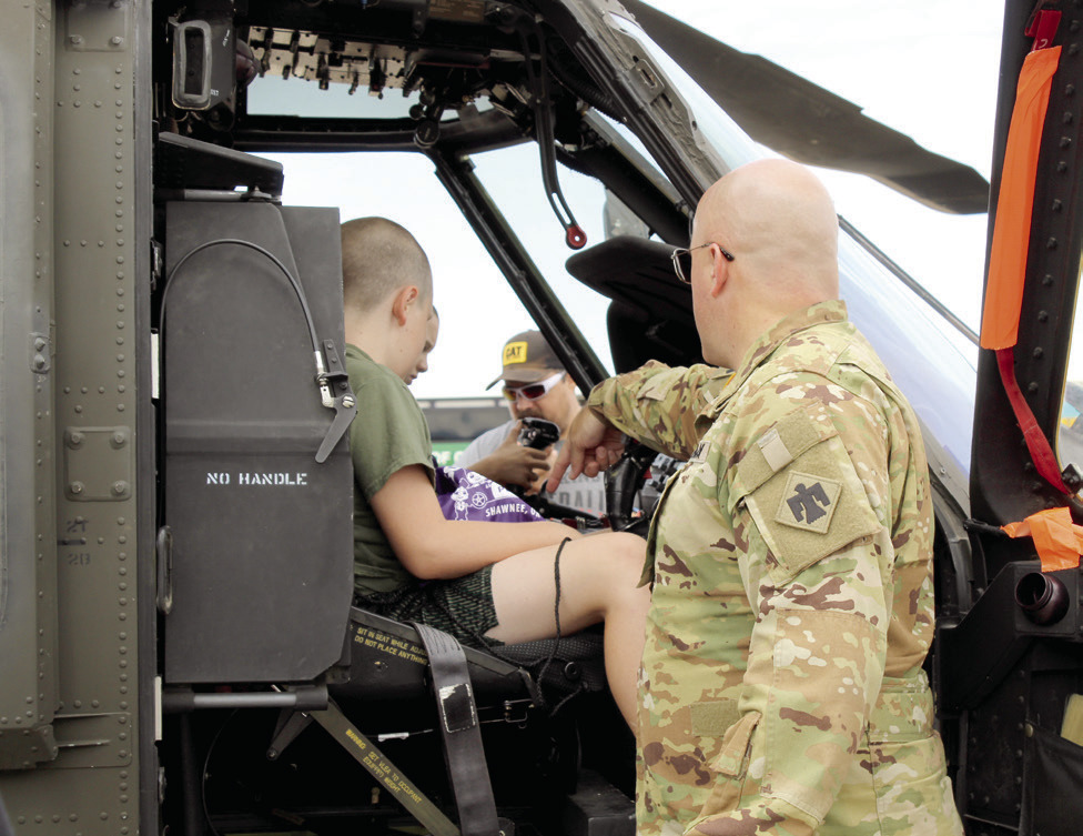 Chief Warrant Officer #3 Ryan Johnson, with the OK Army National Guard out of Tulsa, points to the controls in a UH-60 M Black Hawk helicopter. Johnson said he has been in the U.S. Army a total of 22 years in the infantry, then aviation. There were also helicopters from the U.S. Customs & Border Protection and Air Evac. 