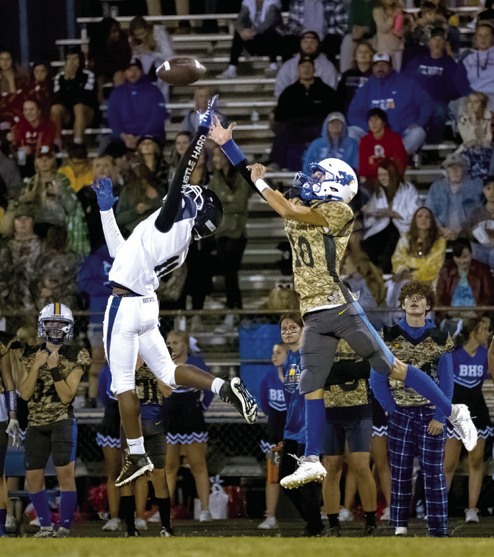 Bethel junior Reagan Curry (#10) and a Star Spencer player try to catch a pass during the Military Appreciation Night home game on Oct. 13. The Bethel Wildcats won 40-38. Photo provided by Richelle Treece.
