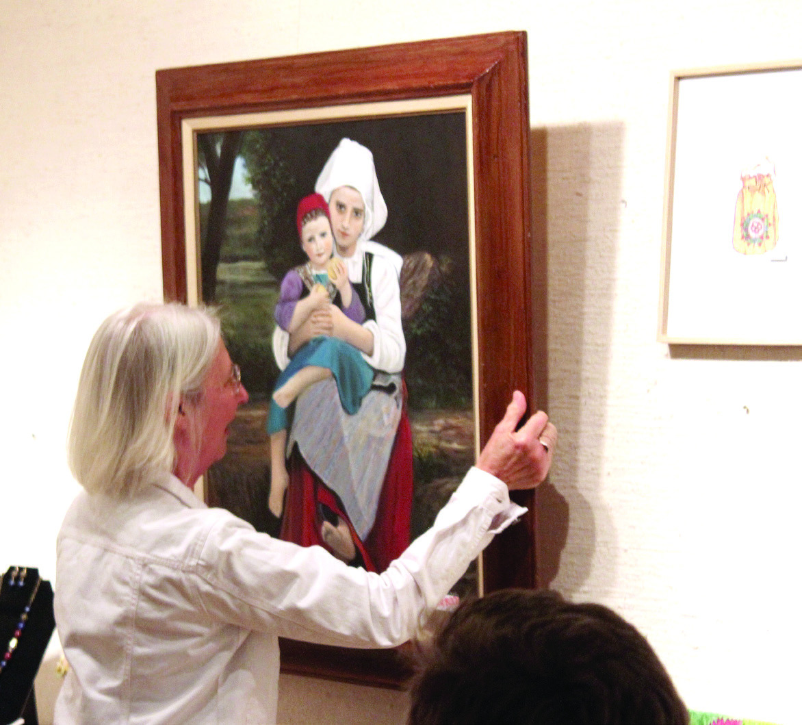 Lisa Vernon selects a Bouguereau study of "Breton Brother and Sister" painted by Charles Spillers of Tecumseh during the Mabee-Gerrer Museum of Art "Off the Wall" event on April 25. Spillers donated three Bouguereau study paintings and two pencil drawings of an elephant and a hawk. According to Director Dane Pollei, 60 artists donated 129 works of art to the 16th annual fundraiser. Natasha Dunagan, Countywide & Sun