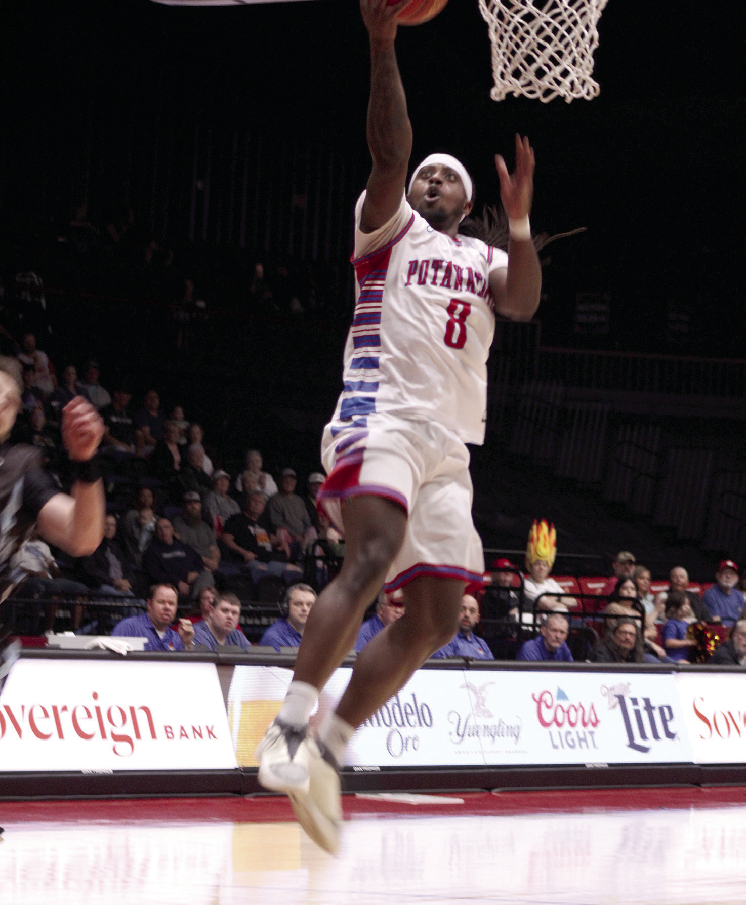 Potawatomi Fire small forward K.D. Moore catches a long pass and sinks the basket during the March 23, 2024 home game with the Texas 7ers. The 2023 TBL National Champs continued their winning streak with a final score of 141-119. File photo