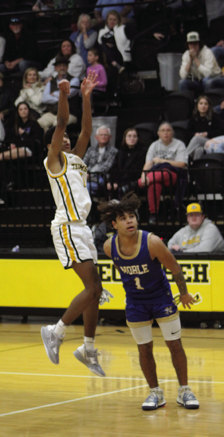 Tecumseh junior Jase Edwards sinks a three-pointer during overtime of the home game against Noble on Jan. 13. Countywide &amp; Sun/Natasha Dunagan