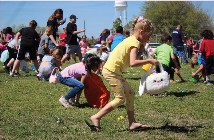 Children in the 7-8 age group pick up plastic eggs during the Tecumseh EGGsperience and Block Party on April 8. The event was organized by volunteers at Tecumseh First Assembly of God and held in the empty lot at South 4th and East Washington streets. Pastor Don Jonker said they were prepared with 7,000 filled plastic eggs, and estimates they hosted between 300 and 350 children. See additional photos on page A7. Countywide &amp; Sun/Natasha Dunagan