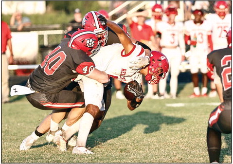 North Rock Creek’s Blain Robison makes the tackle in action Friday night against Prague. NRC lost the game 34-26 making their record this season 1-1. NRC face Holdenville Friday, Sept. 15. Photo courtesy of Gowin Photography.