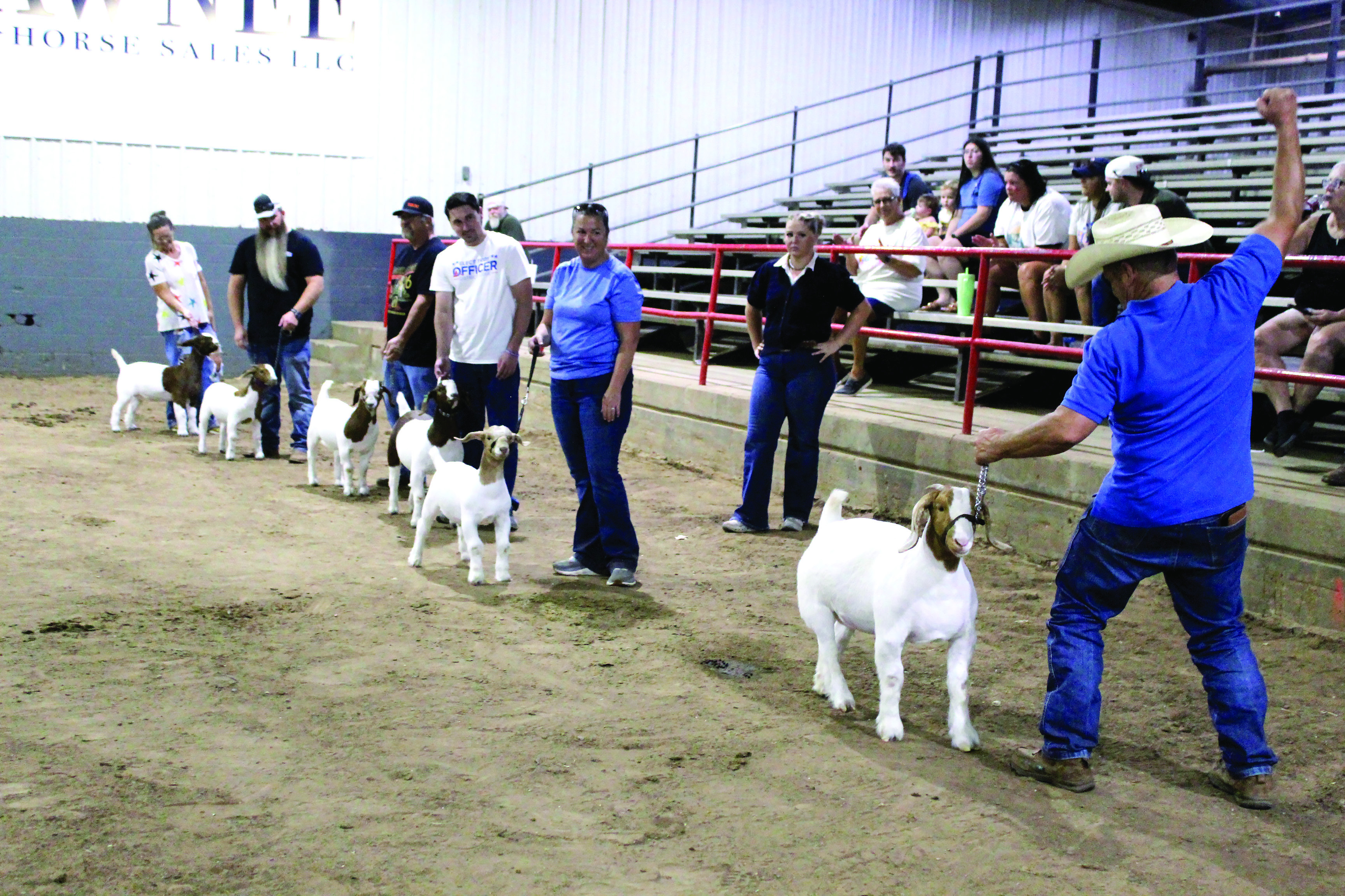 State Representative Danny Sterling, far right, celebrates winning the Celebrity Showmanship Goat Contest at the Pottawatomie County Free Fair on Sept. 12. From left, the other exhibitors were Lindsey Emerson, Kevin Harbison, Joe Milburn, Troy Officer and Charilyn Milburn. Also shown is Josey Milburn. Photos by Natasha Dunagan, Countywide & Sun