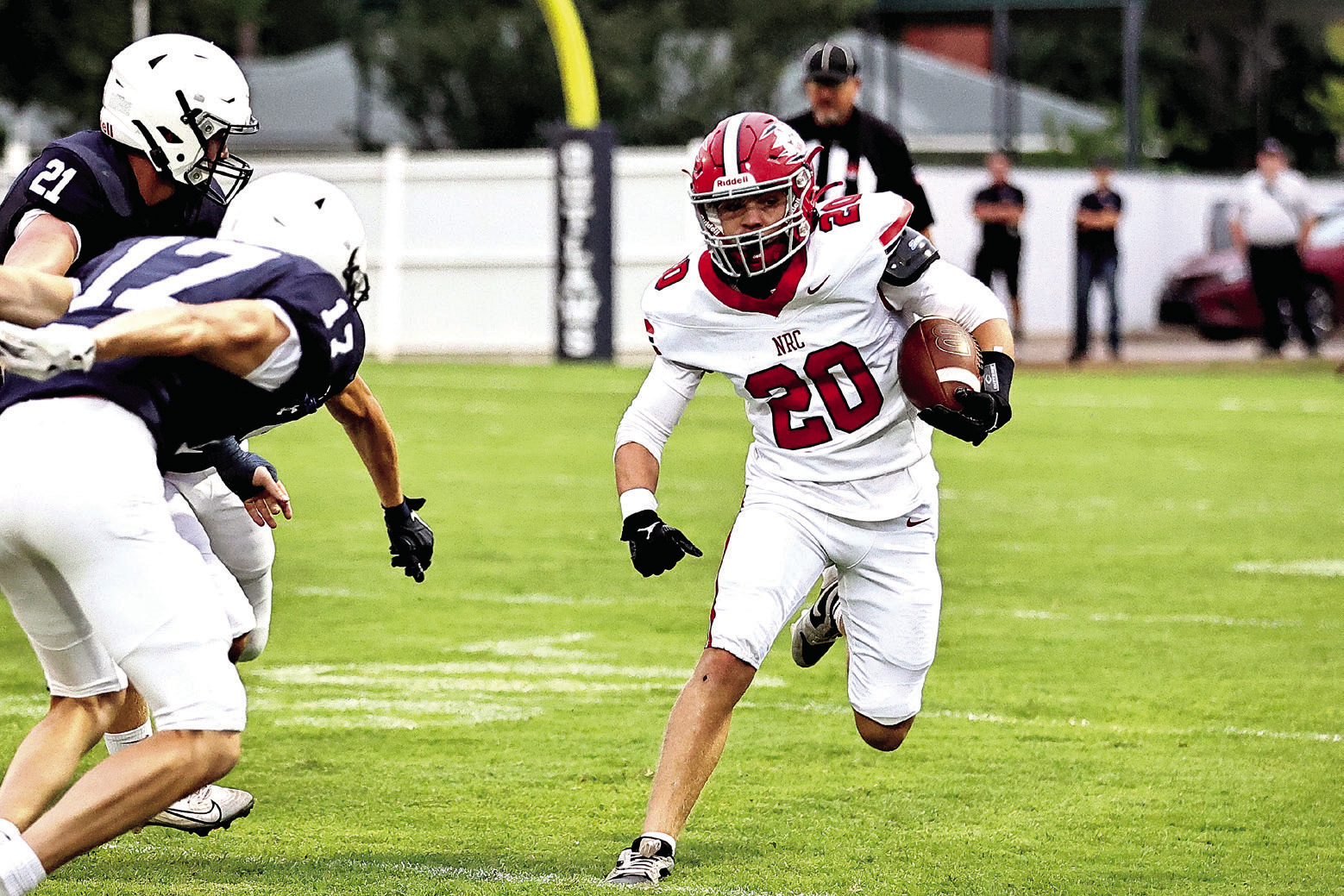 Hunter Bertram tries to go around the Marlow defense in the season opener Aug. 29. Photos Courtesy of Gowin Photography
