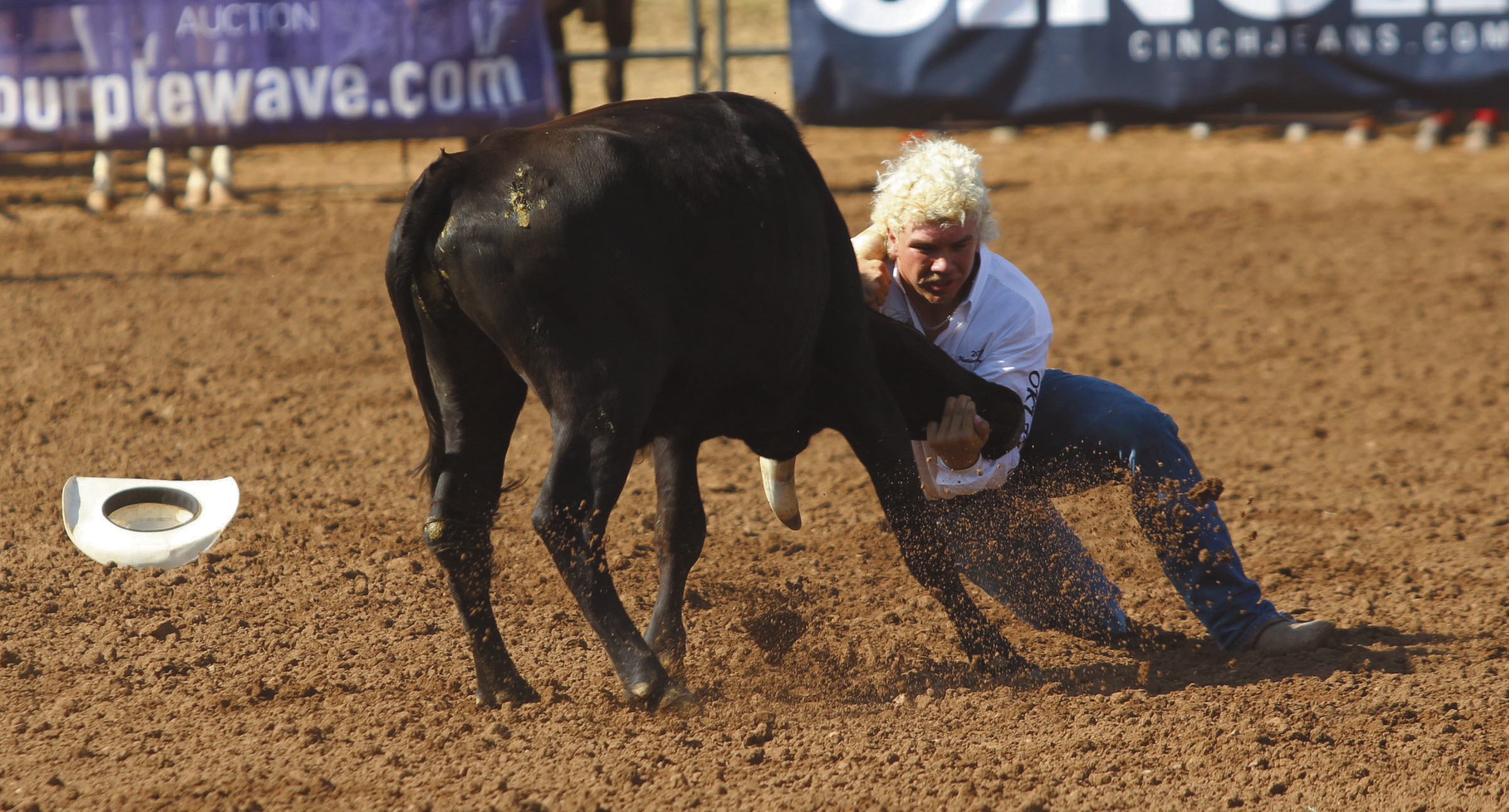Dally Trussell of McLoud wrestles a steer in the second go-round of the IFYR on the morning of July 11. Natasha Dunagan, Countywide & Sun 