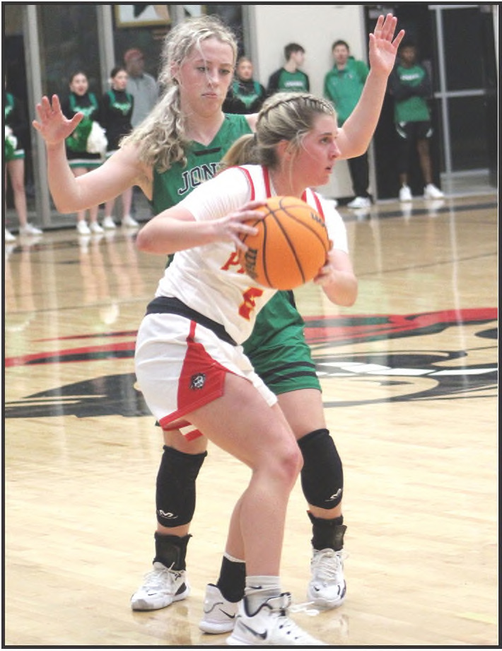 Dale’s McKenzy Herman looks to pass in the home game against Jones on Jan. 3. The Lady Pirates won, 53-37, and the Pirates won their game, 71-52.