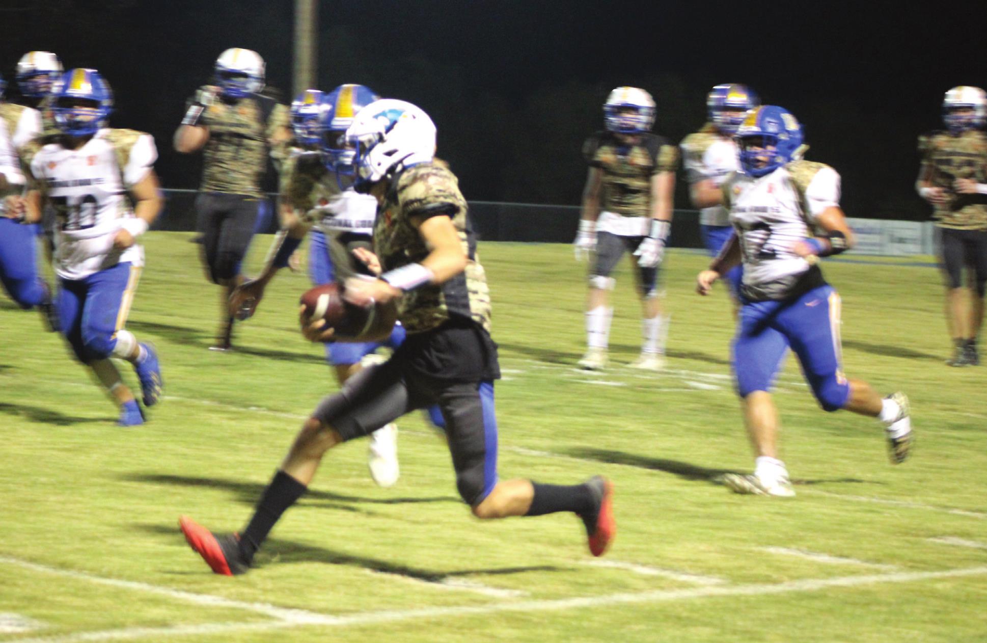 Bethel freshman Bryce Tapley runs down the sideline during the district home game against Holdenville on Military Night, Oct. 14. Bethel won 67-13. Countywide &amp; Sun/Natasha Dunagan
