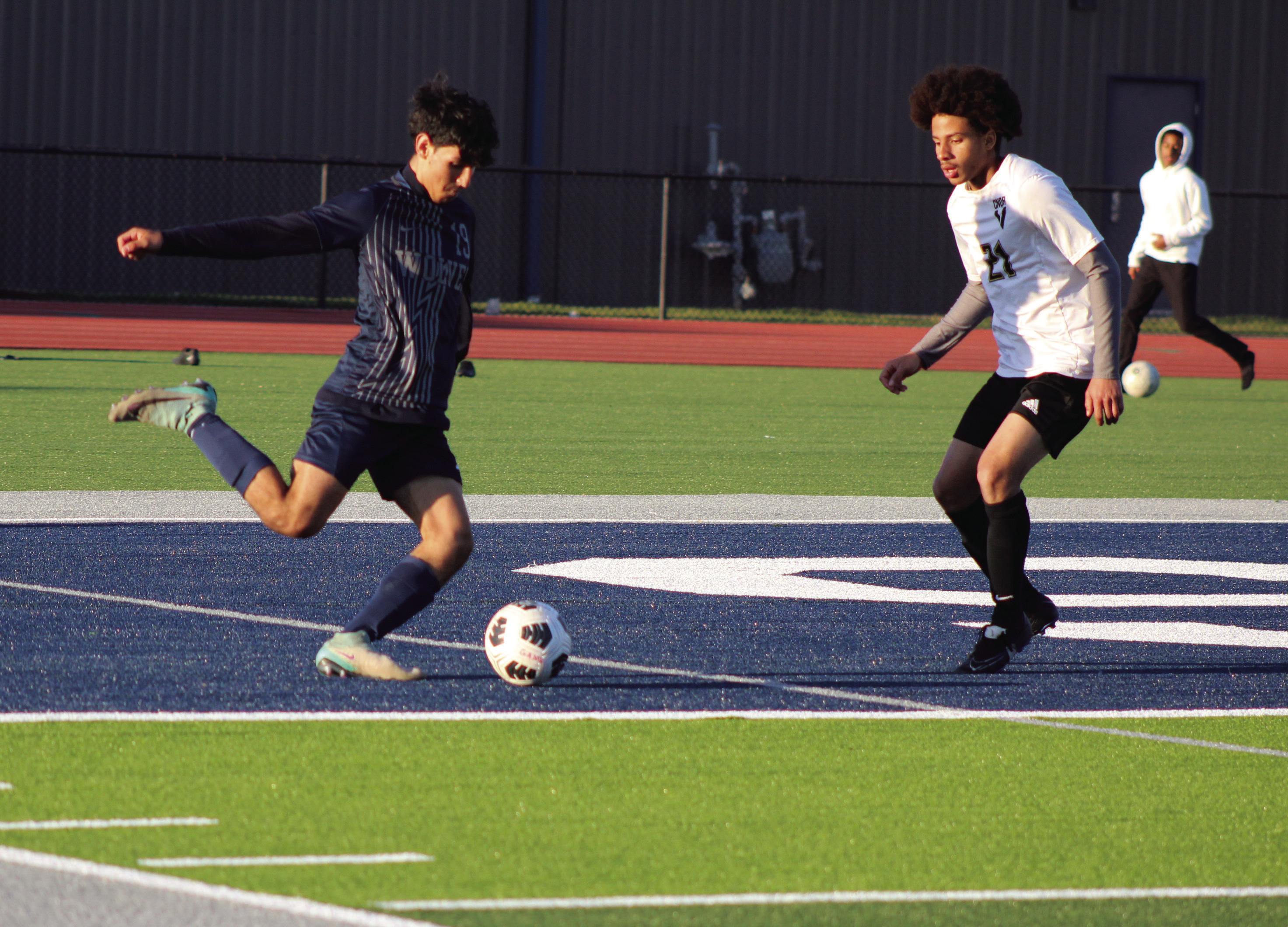 Shawnee’s Ivan Macias makes a corner kick during the April 2 game with Victory Christian. The Shawnee soccer teams were the first athletes to play on the new turf at Jim Thorpe Stadium. The Wolves lost, 0-1 in overtime, and the Lady Wolves lost, 0-6. Countywide & Sun/Natasha Dunagan