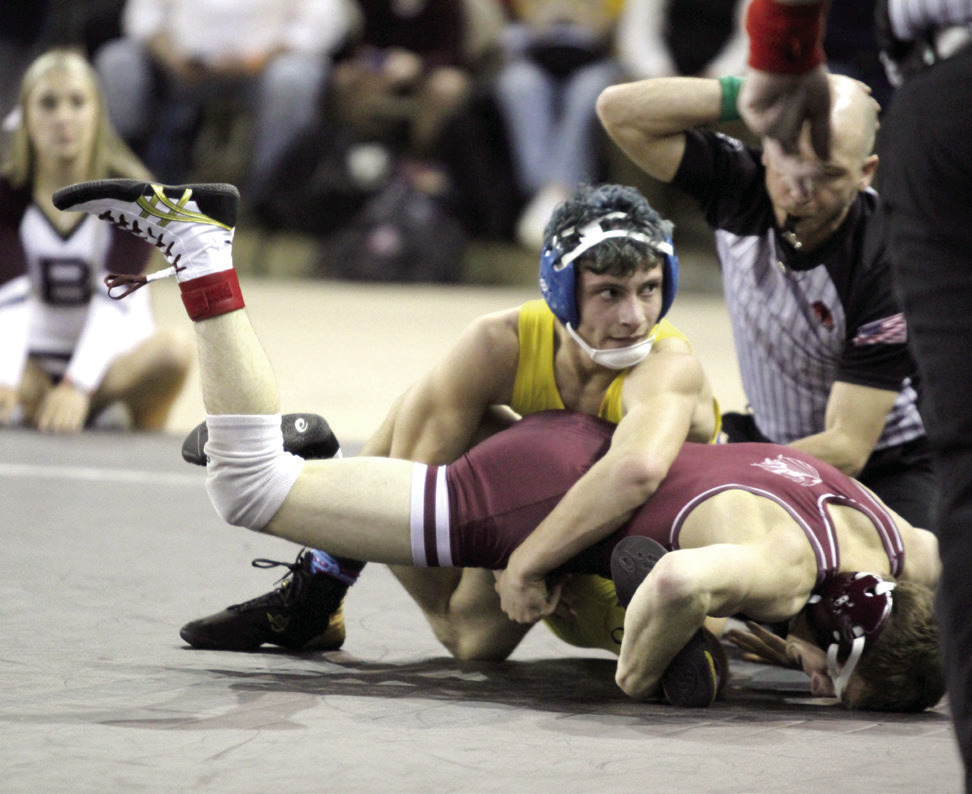 Bethel sophomore Paxton Shultz tries to flip his opponent in the 120 weight division of the OSSAA Class 3A Boys Wrestling State Championship on Mar. 1 at the State Fair Arena. Shultz placed second in the state. Natasha Dunagan, Countywide & Sun