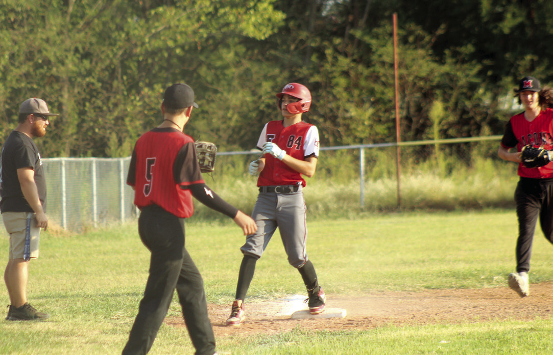 After hitting a triple, Earlsboro junior Cameron Black lands on third base. Photos by Natasha Dunagan, Countywide & Sun