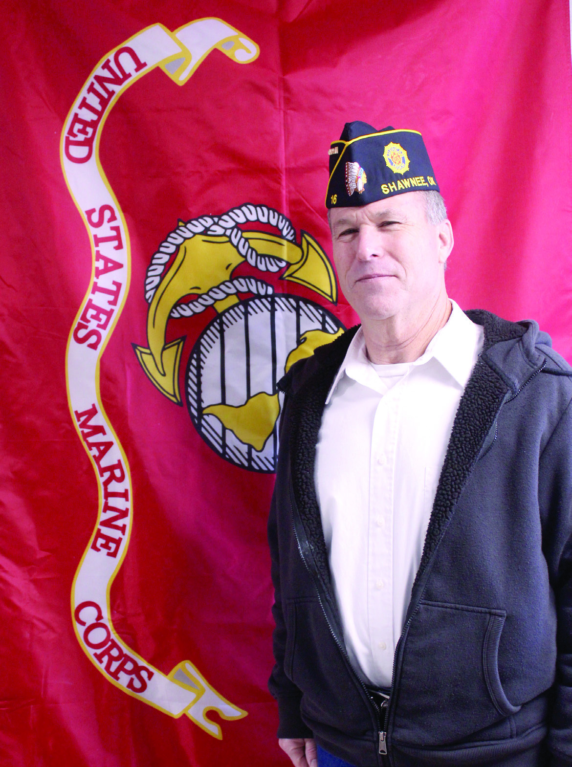 Retired Veteran David Baker poses with the U.S. Marine Corps flag. Baker served for 11 years in Combat Arms, working on tanks, and for another 11 years in Electronics before retiring from the Marines. Natasha Dunagan, Countywide &amp; Sun