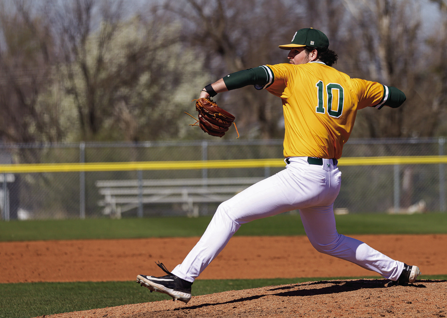 Oklahoma Baptist University’s Nolan Feazle winds up for the pitch in action against Northwestern. The senior pitcher finished the first of a double header with seven strikeouts and got seven fly-ball outs as well. Photot provided by OBU