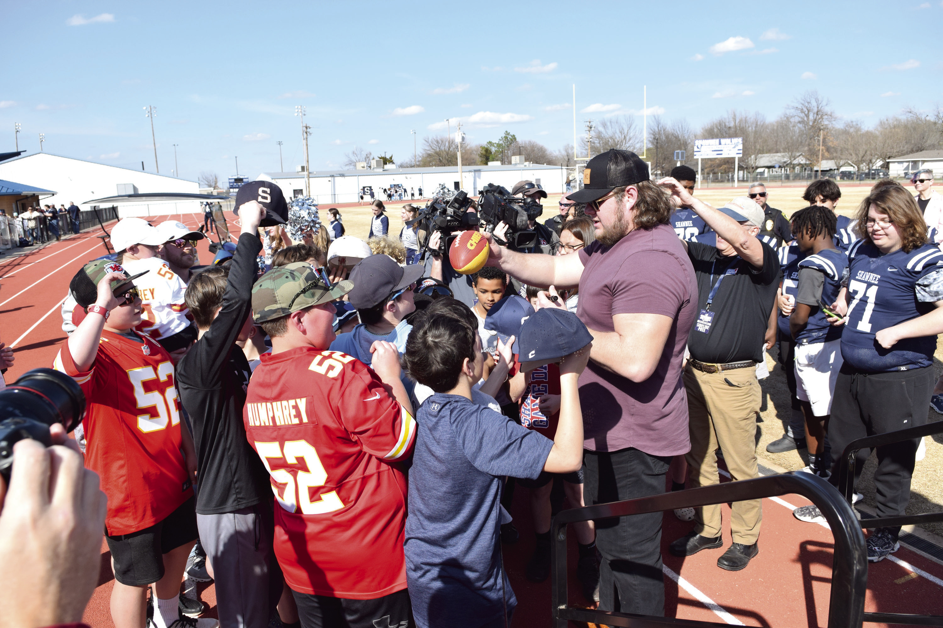 Kansas City Chiefs Center Creed Humphrey signs autographs following the celebration in his honor at Shawnee High School on March 4. Countywide & Sun/Julie Talton