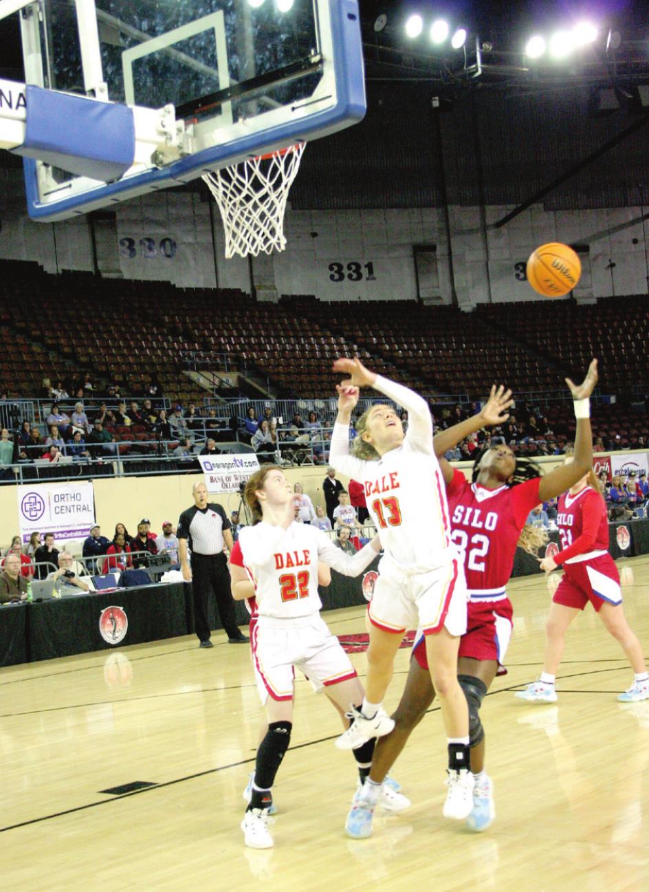 Dale’s Makenzie Gill (#13) and Silo’s Tiani Ellison (#32) battle for possession during the opening round of the Class 2A State Tournament. Dale won the game 67-55, advancing to face Pocola in the semifinals, where they lost 62-63 in overtime, Friday. Countywide & Sun/Kendra Johnson