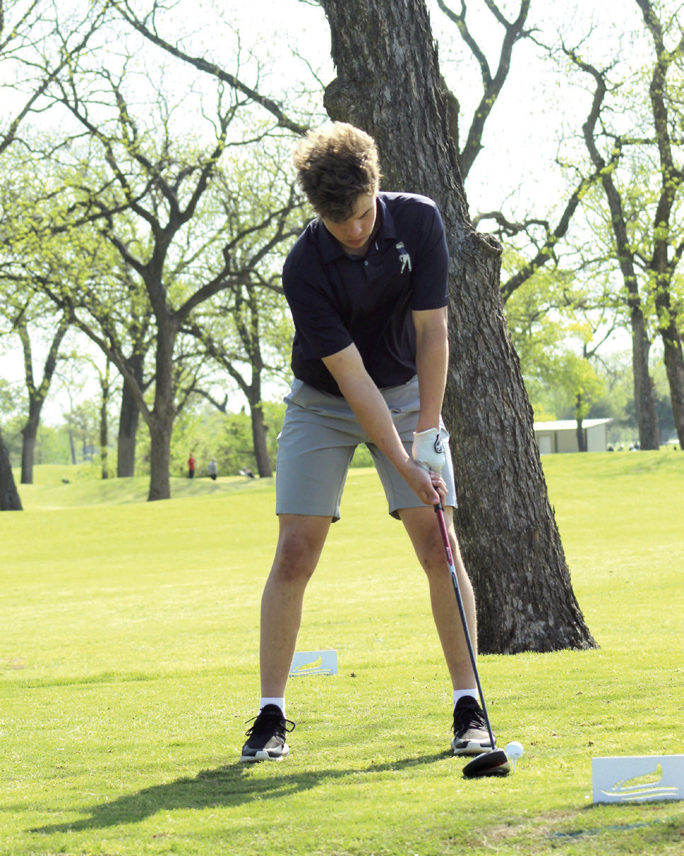 Shawnee senior Gage Lomeli prepares for a drive at FireLake Golf Course during the Tecumseh Boys Golf Tournament on April 9.