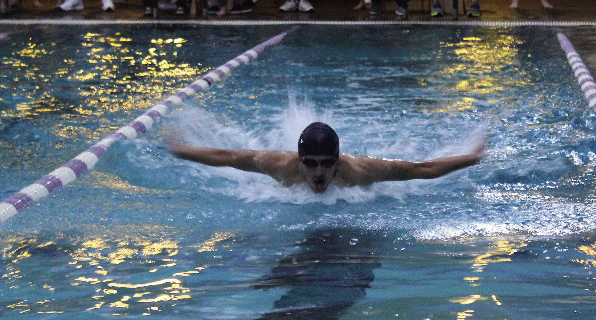 Shawnee senior Vincent Tash competes in the Boys 100 Yard Butterfly during the swim meet with Moore, Southmoore and Westmoore athletes on Nov. 10 at the Shawnee YMCA. Tash placed fourth in the event with a 1:07.90. His teammate and fellow senior Ethan Oller placed first with a 55.84. Shawnee placed first in the Combined Team Scores, with 803 points. They had 416 points for the women and 387 points for the men. Countywide &amp; Sun/Natasha Dunagan
