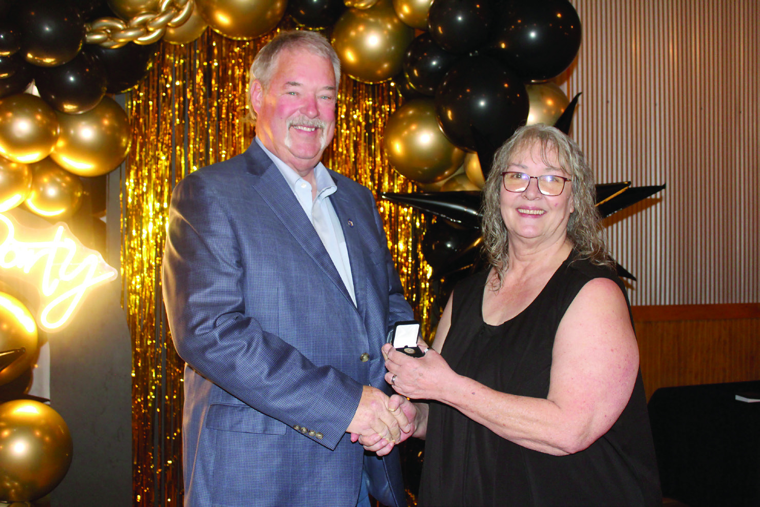 Countywide & Sun Owner and Publisher Suzie Campbell, right, presents Randy Gilbert with his Pottawatomie Power Poll Top 10 lapel pin during the Awards Gala on Oct. 24. Gilbert placed ninth in the five-year event. Natasha Dunagan, Countywide & Sun