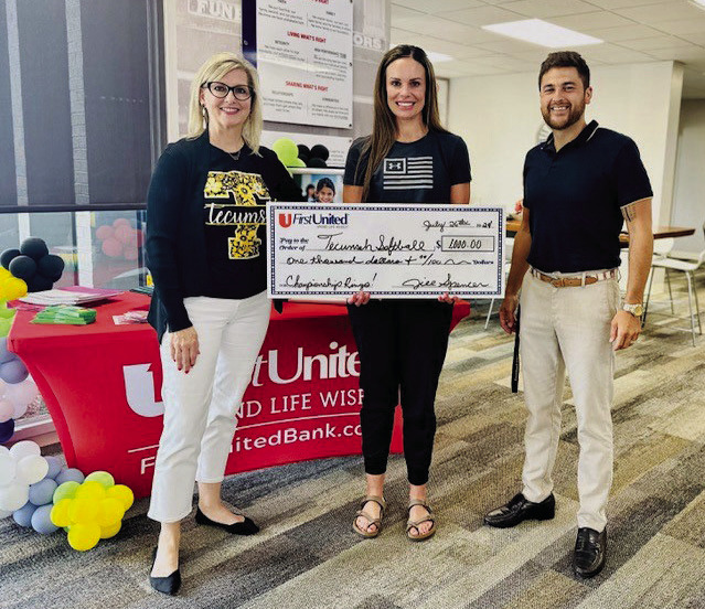 First United Bank donates $1,000 to the Tecumseh Lady Savages to assist in the funds being raised for the purchase of the 2024 State Championship rings. Pictured from left, FUB Tecumseh President Jill Spencer, Tecumseh Athletic Director Casi Bays, and Tecumseh Public Schools Director of Community Engagement Justin Wood. Photo provided by FUB
