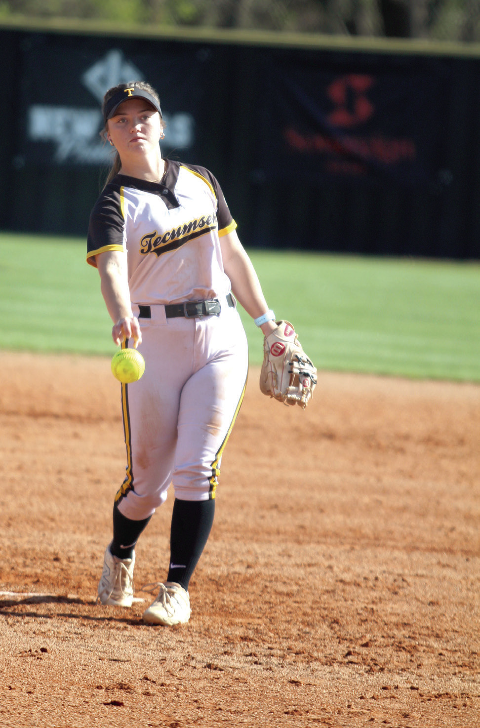 Tecumseh senior Jessi Hull sends it sailing across home in the game against McLoud.