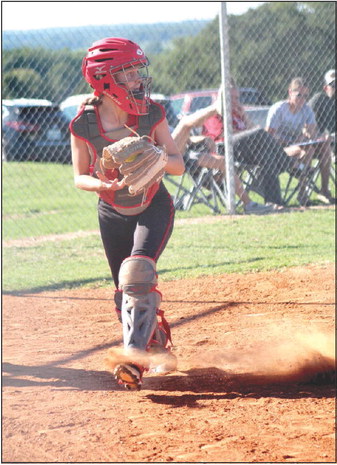 Macomb senior Arie Hazell kicks up dust as she goes to return the ball to the pitcher in the home game against Sasakwa on Sept. 12. Sasakwa won 8-1. Countywide &amp; Sun/Natasha Dunagan