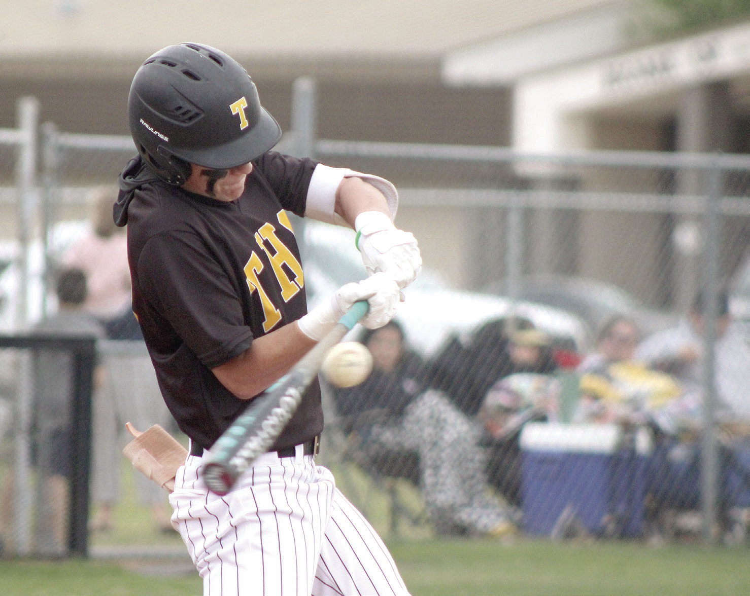 Tecumseh sophomore Wyatt Dodgion makes contact with the ball in the April 14 home game against Seminole. The Savages won, 8-0. Natasha Dunagan, Countywide & Sun