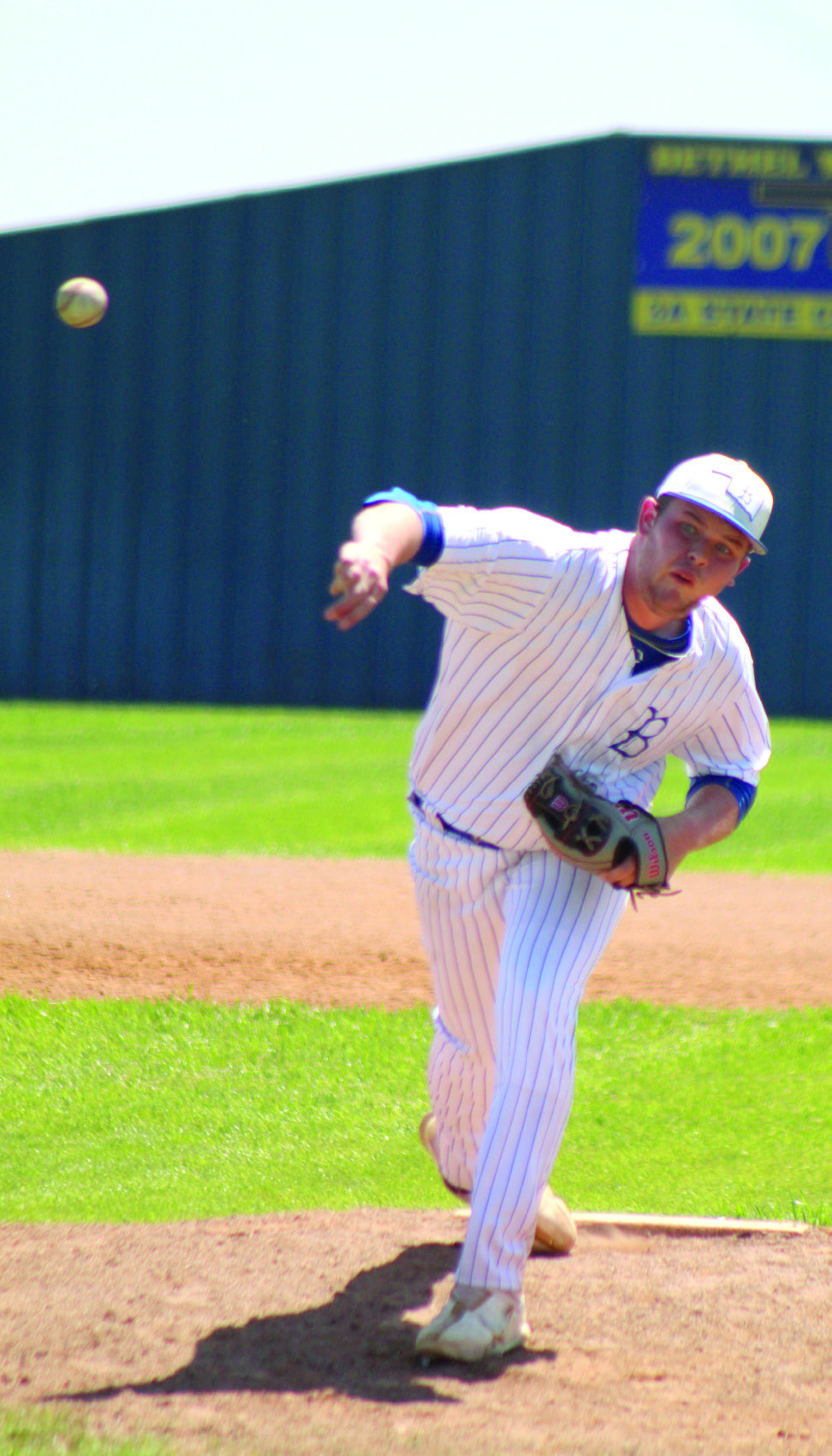 Bethel’s A.J. Carpenter slings the ball past home plate in the home game with Prague on April 14. The Wildcats won, 9-1. Countywide &amp; Sun/Natasha Dunagan
