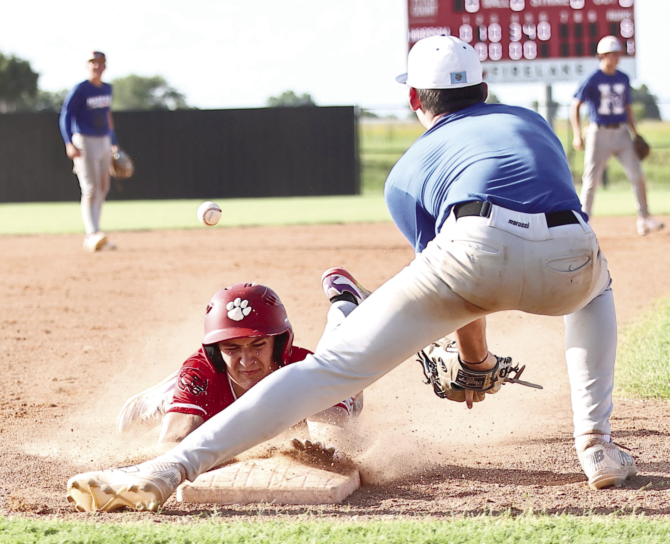 North Rock Creek's Hasten Conley beats the throw to third. Photos courtesy of Gowin Photography