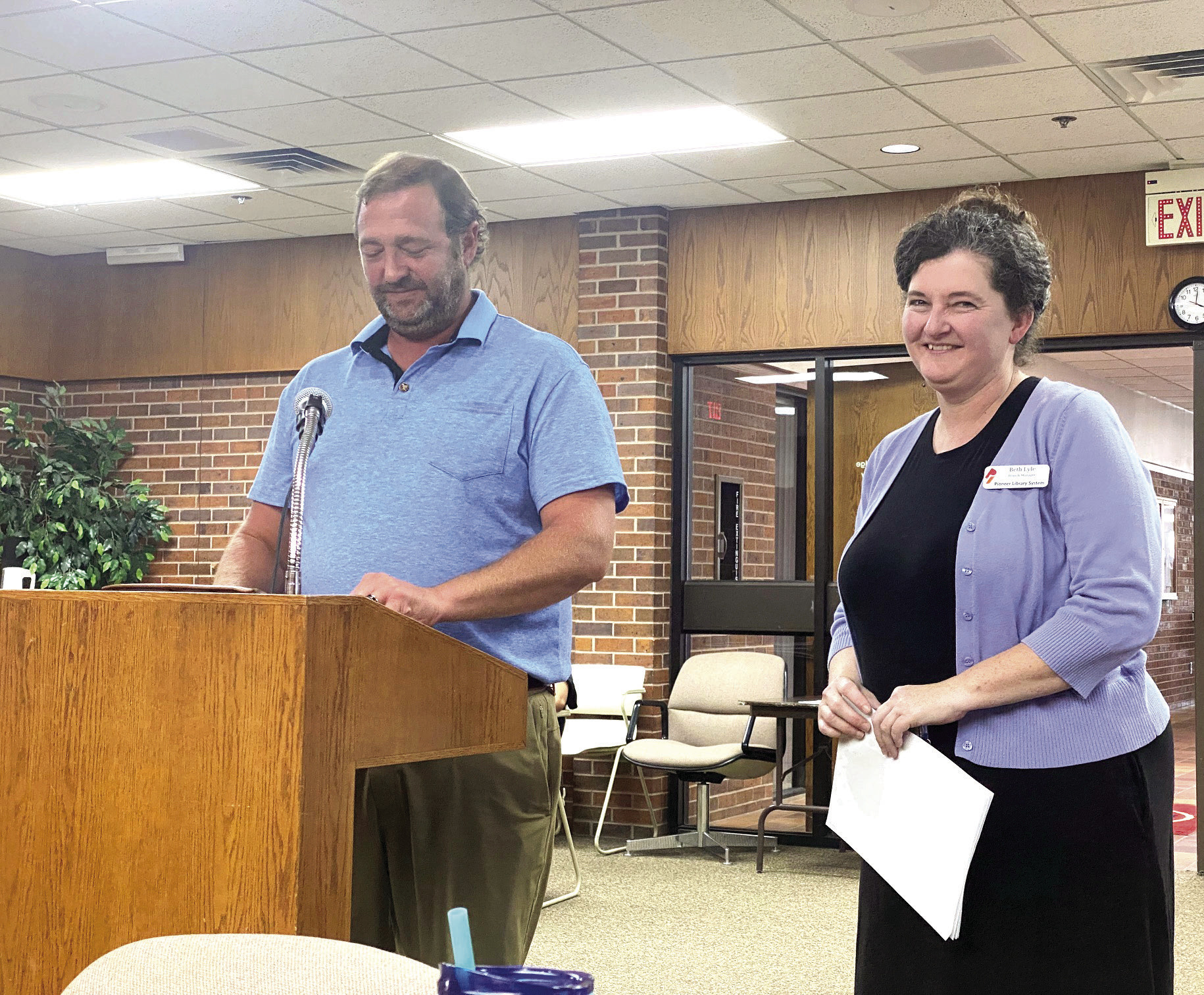 Will Merrick, Development Officer, with Pioneer Library System Foundation speaks with the Tecumseh City Council alongside Beth Lyle, Tecumseh Library Branch Manager, about applying for a TSET Legacy Grant. Julie Talton, Countywide & Sun