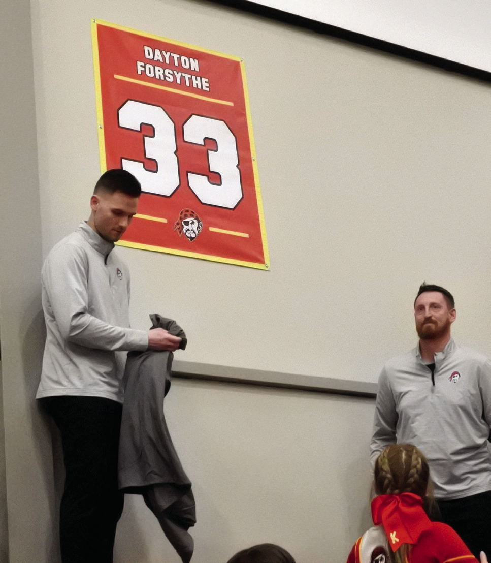 The retired #33 is revealed to the crowd.