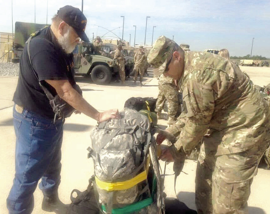 Vietnam Veteran, Staff Sgt. Timothy Lawrence, of Shawnee, helps his grandson, Dale graduate Major Jerame Johnson, to prepare for deployment to Qatar from Fort Sill in Lawton in 2016. Both veterans retired from the Army after at least 20 years. Lawrence's family recently found his memoir and had it published, seven years after his passing — "leaving something behind so we could understand where he came from and what shaped him.” Photos provided