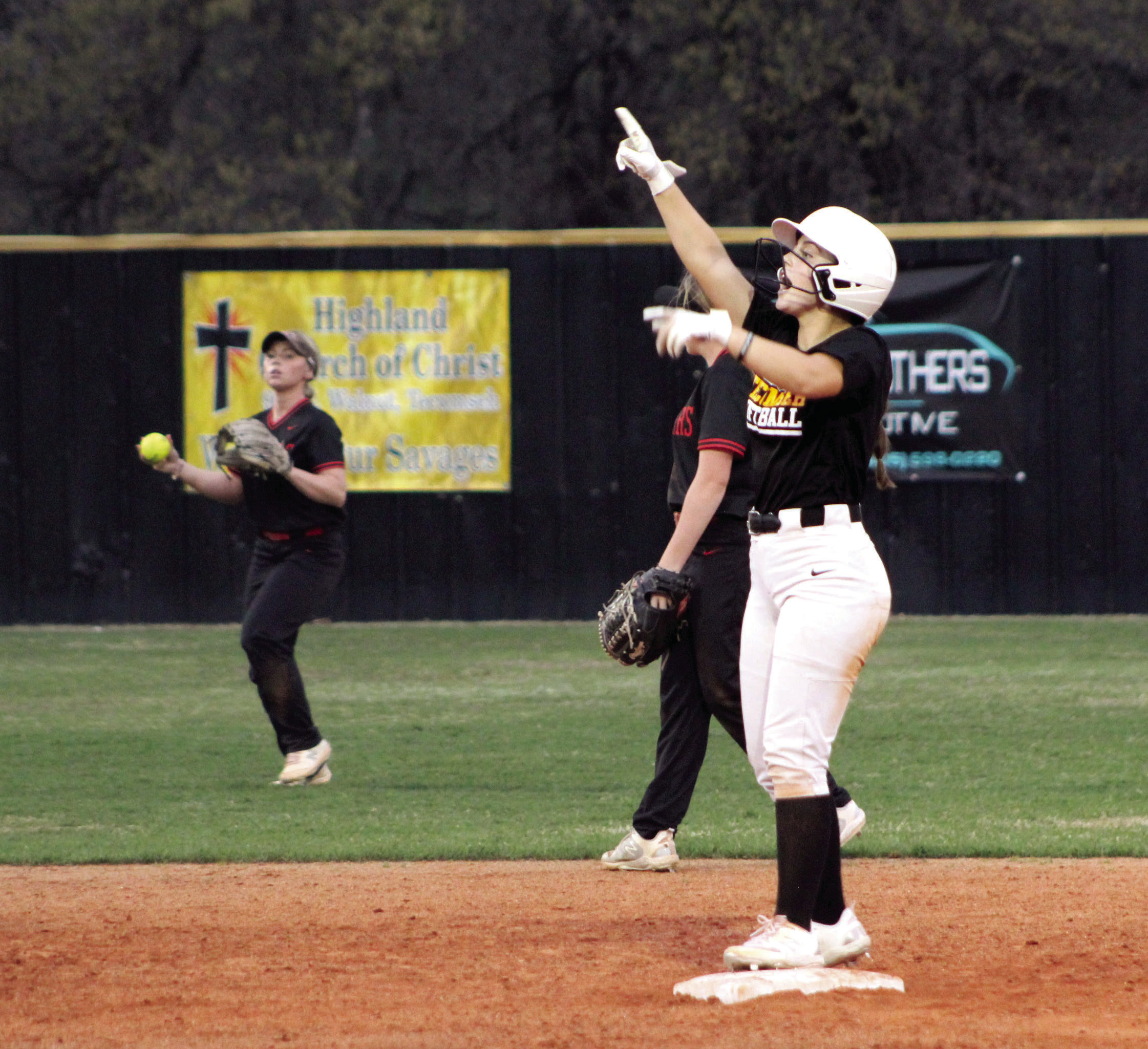 Tecumseh senior Taylor Gage claps and motions to her team after making a double during the Lady Savages' second home game of the evening, April 4. They won that game against Westmoore, 15-5, and with Latta, 6-4. Countywide & Sun/Natasha Dunagan