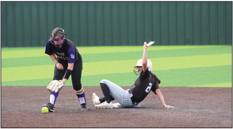 Tecumseh freshman Madison Gray slides into second base as the Red Oak player drops the ball during the Dale Festival on Sept. 15. The two-day tournament was held at FireLake Ball Fields and the Lady Savages won both their games. Countywide &amp; Sun/Natasha Dunagan