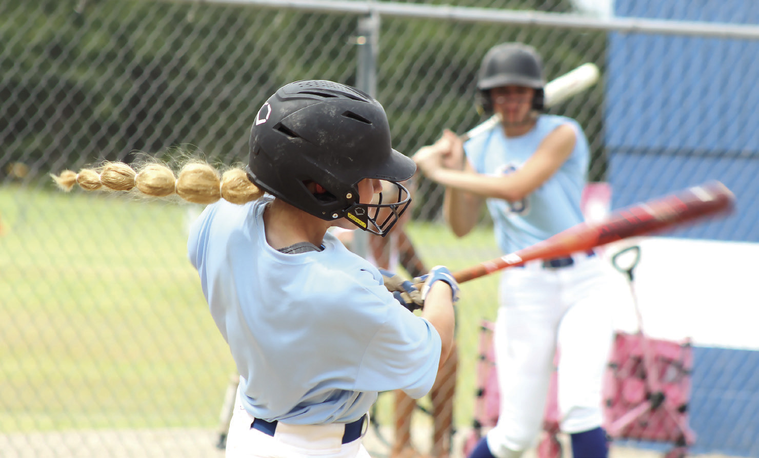 Bethel junior Hailey Hanmer makes contact at bat during the scrimmage with Harrah on Aug. 6. The Lady Wildcats began their season at home against Newcastle on Mon., Aug. 10. Photos by Natasha Dunagan, Countywide &amp; Sun