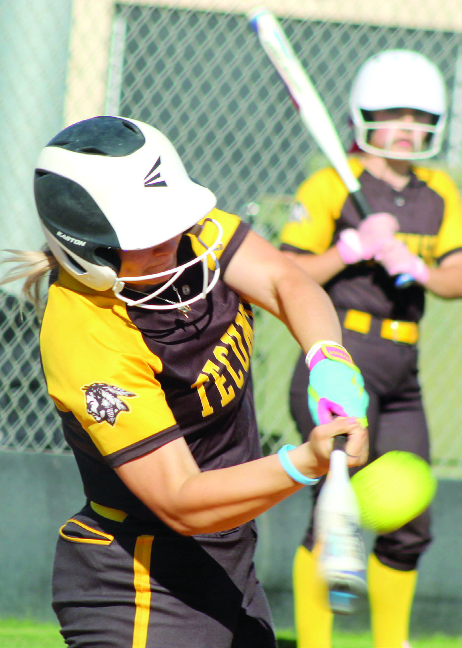 Tecumseh senior Steeli Mitchell smacks a single during the second inning of the home game against McLoud on April 7. The Lady Savages won 2-0. Natasha Dunagan, Countywide &amp; Sun