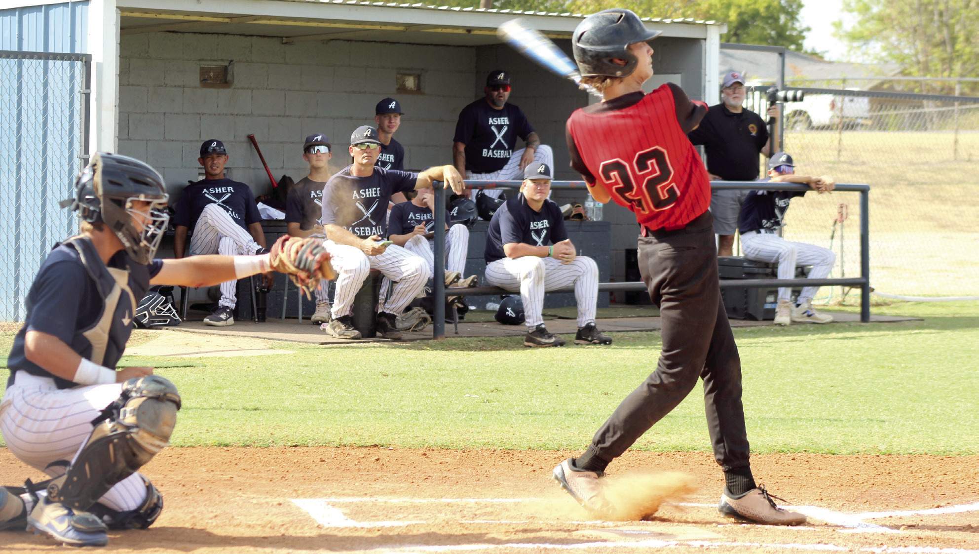 Macomb freshman Asher Schooler takes a swing, as Asher senior Hunter Francis makes the catch during the Class B District Tournament game at Asher on Sept. 23. The Indians won 23-0. They also won both their games against Whitesboro on Sept. 23, 19-4, and on Sept. 24, 14-6. Photos by Natasha Dunagan, Countywide & Sun