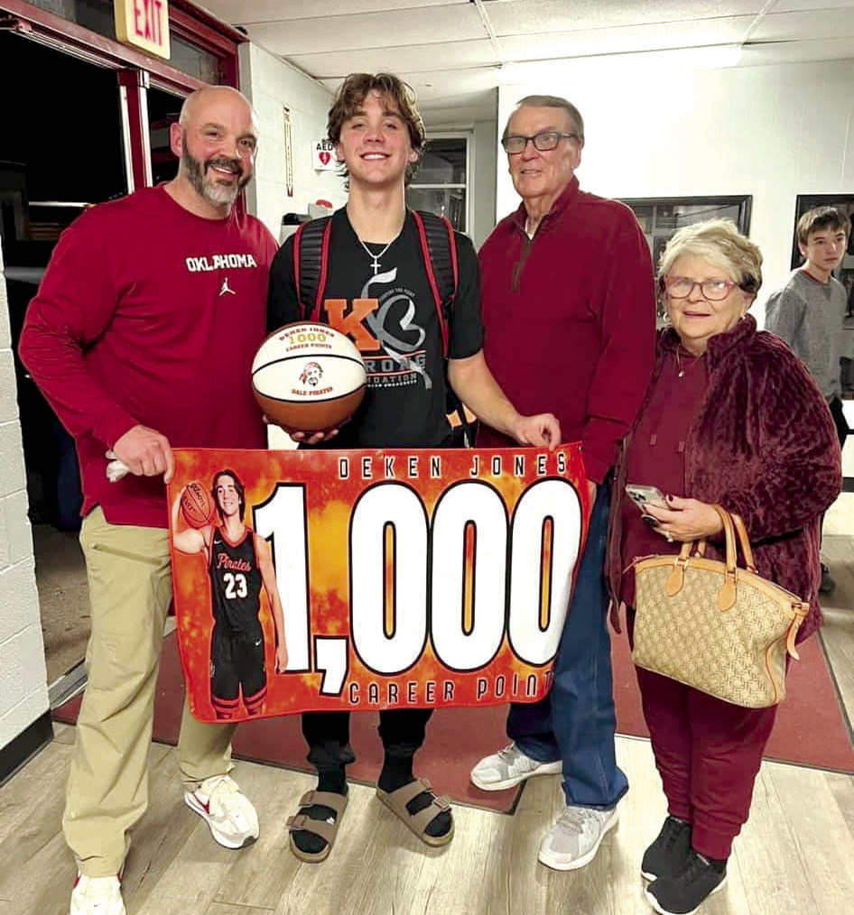 Dale senior Deken Jones reached 1,000 career points during the basketball game at Luther on Dec. 12. Shown, from left, are his father Derek Jones, Jones, grandfather retired Coach Harold Jones and grandmother Vicki Jones. Photo provided.