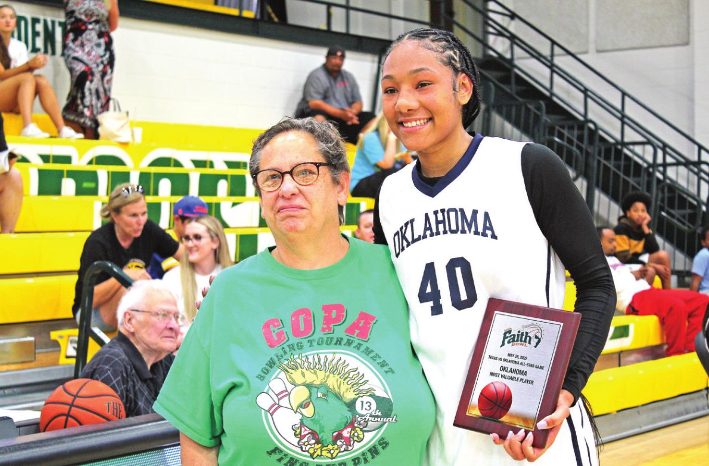 Karla Rodd presents the OK MVP to Darianna Littlepage-Bugg.